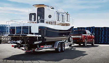 2022 Nissan TITAN Truck towing boat | Rydell Nissan of Grand Forks in Grand Forks ND