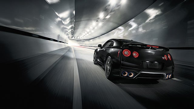 2023 Nissan GT-R seen from behind driving through a tunnel | Rydell Nissan of Grand Forks in Grand Forks ND